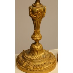 A pair of Louis XVI-style candlesticks