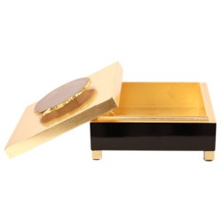 Black and gold lacquered box with a stone knob
