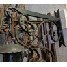 Lantern with a black wrought-iron bracket