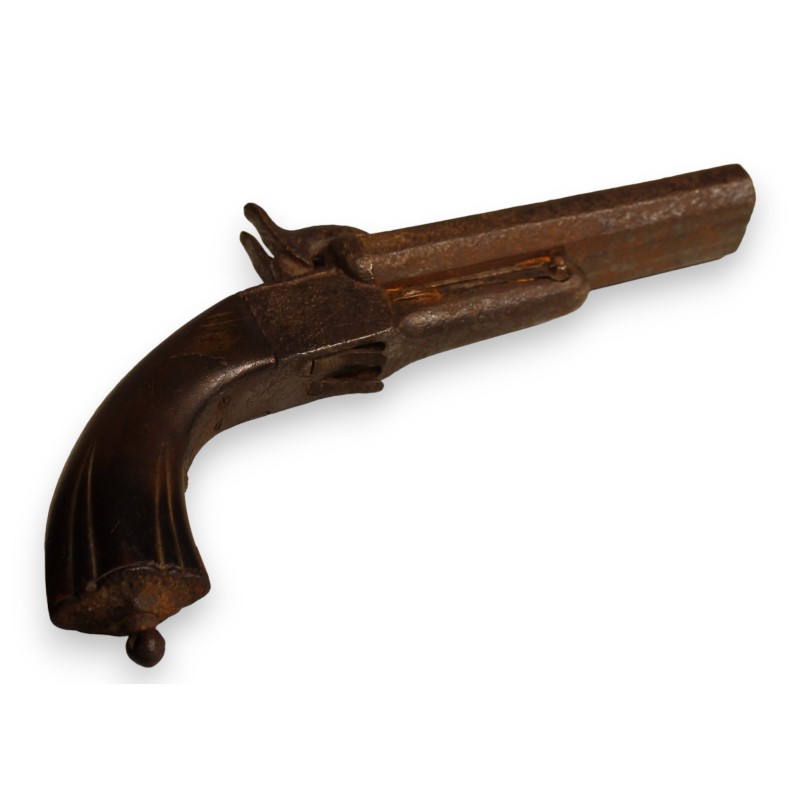Percussion pistol with a retractable trigger