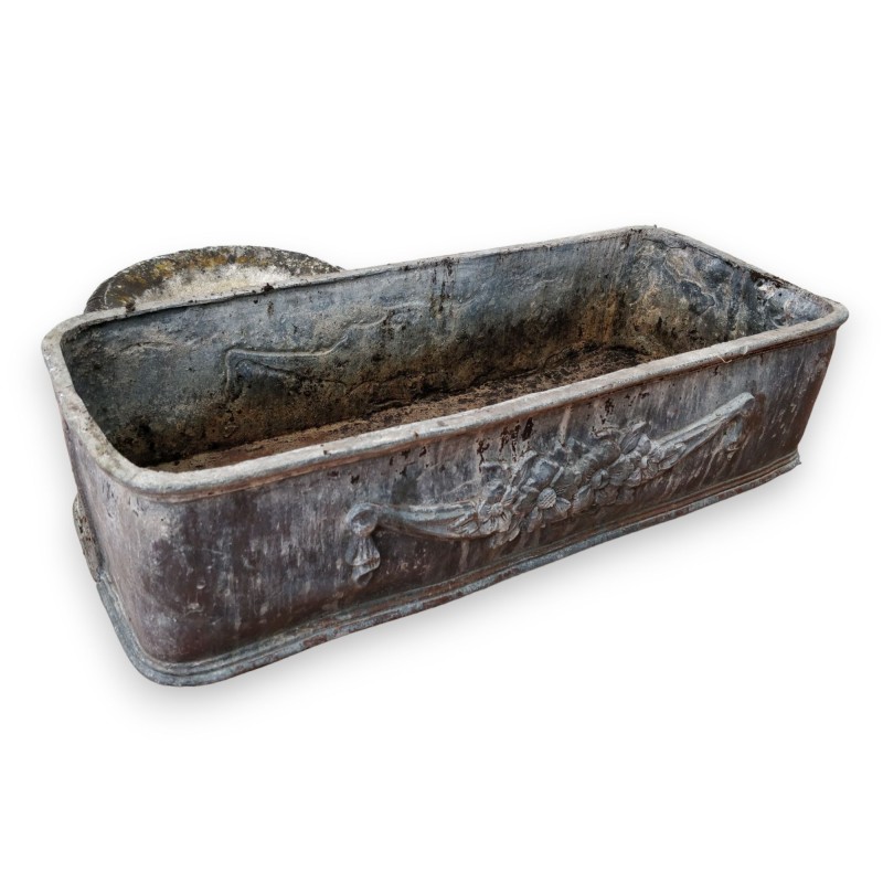 Lead planter with floral decoration