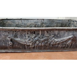 Lead planter with floral decoration