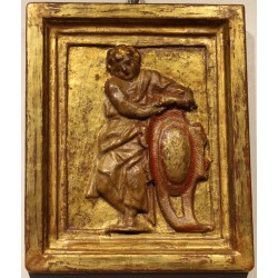 Paire de portaits en bois sculpté doré