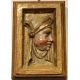 Paire de portaits en bois sculpté doré