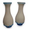 A pair of white and blue opaline vases