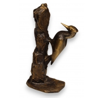Pic sur tronc en bronze signé REUSSNER