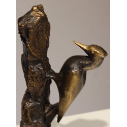 Pic sur tronc en bronze signé REUSSNER