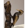 Pic sur tronc en bronze signé REUSSNER