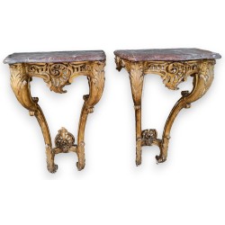A pair of Louis XV side tables in gilded wood
