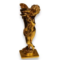 Bronze doré \"Cupidon versant sur un coeur\"