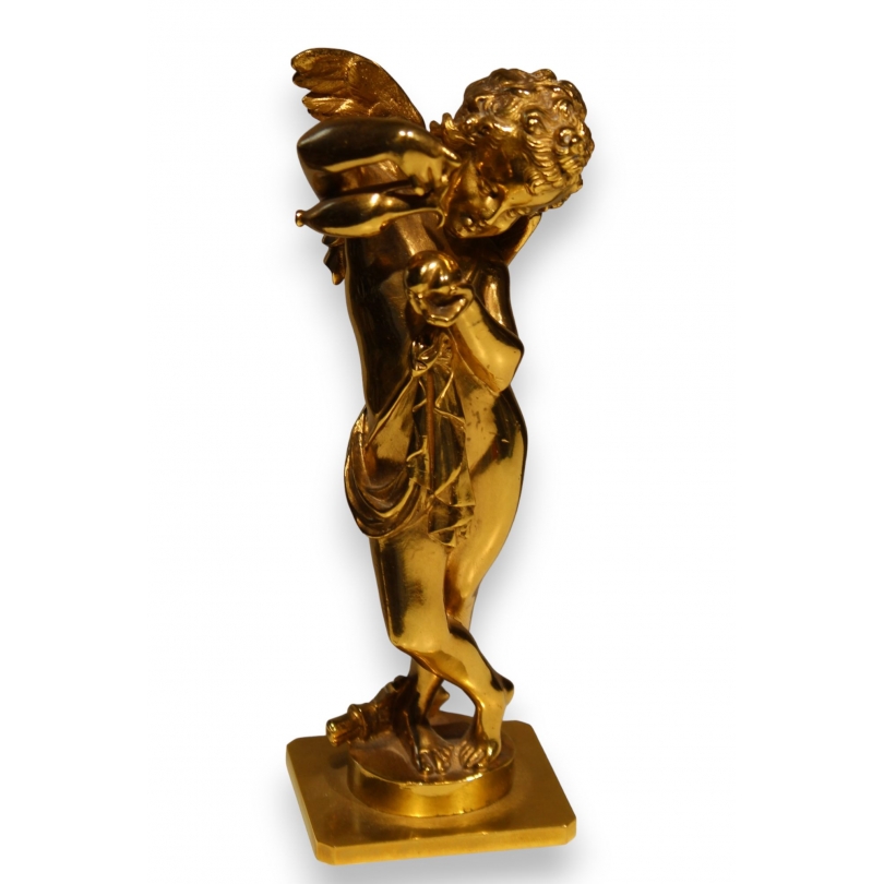 Bronze doré "Cupidon versant sur un coeur"