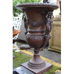 Pair of bronze vases with female handles