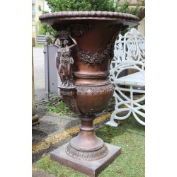 Pair of bronze vases with female handles