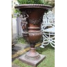 Pair of bronze vases with female handles