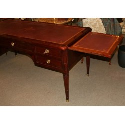  Bureau plat Louis XVI avec 4 tiroirs et 2 tirettes sur  Moinat SA  - Antiquités décoration