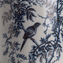 Round porcelain plant pot with a bird design