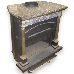 Parisian Empire-style fireplace with columns. At  Moinat SA  - Antiques and home décor