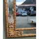Miroir style Régence doré à fronton sculpté