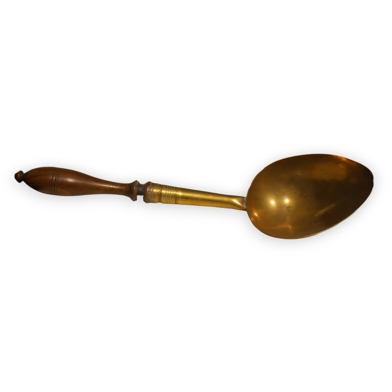 Large spoon made of brass and wood