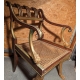 Fauteuil Regency aux pattes de lion, assise cannée