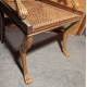 Fauteuil Regency aux pattes de lion, assise cannée