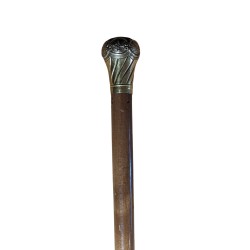 Walking stick with a repoussé brass knob