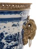 Blue and white plant pot with bronze trim