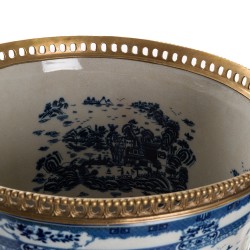 Blue and white plant pot with bronze trim