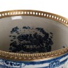 Blue and white plant pot with bronze trim