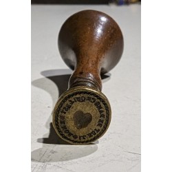 Wooden seal: "What is outside is inside"