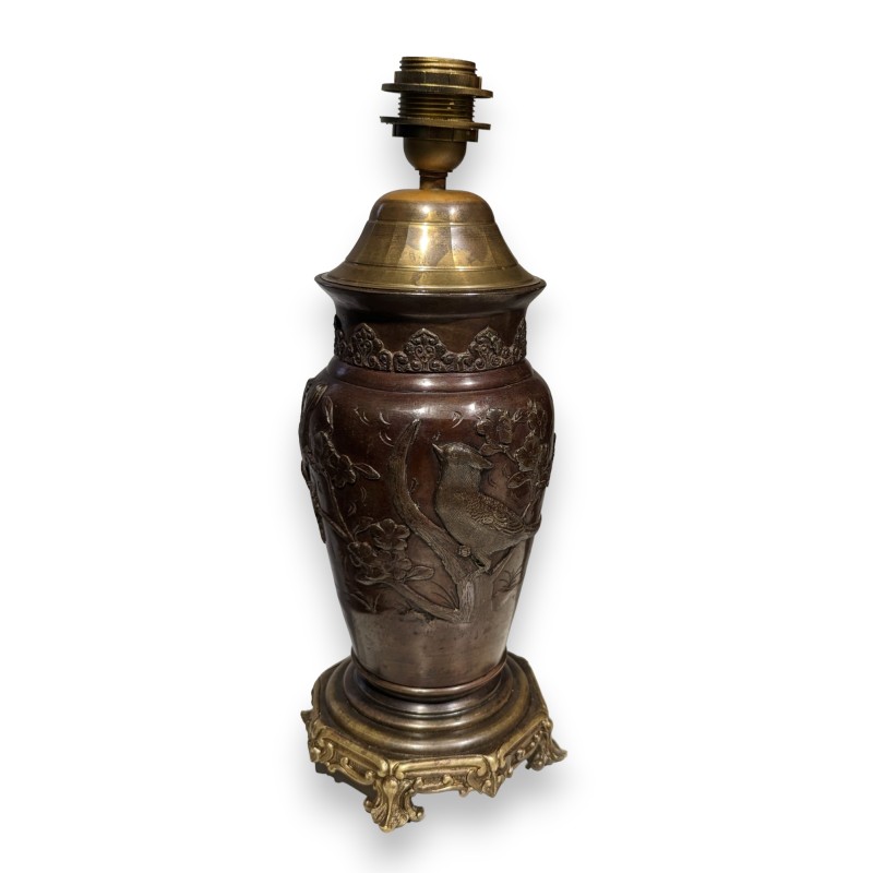 Bronze lamp with a relief design of birds