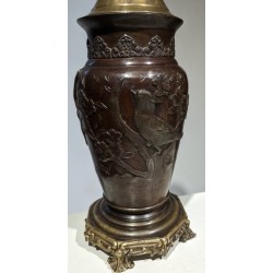 Bronze lamp with a relief design of birds
