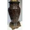 Bronze lamp with a relief design of birds