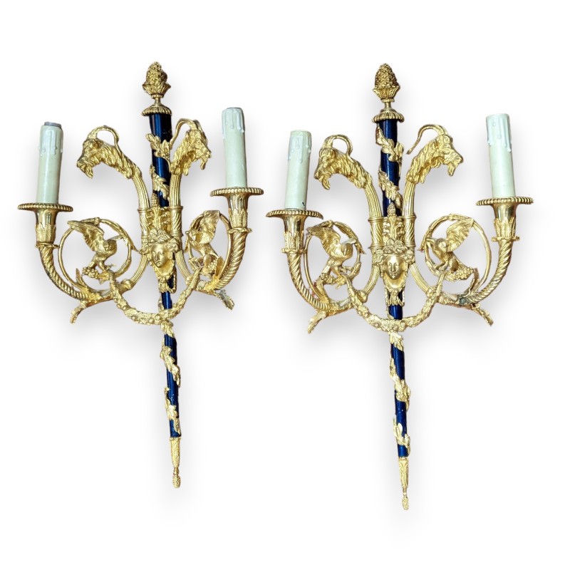 A pair of Louis XVI wall sconces in gilded bronze and blue