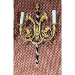 A pair of Louis XVI wall sconces in gilded bronze and blue
