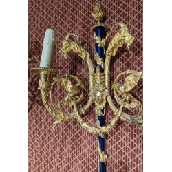 A pair of Louis XVI wall sconces in gilded bronze and blue