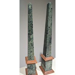 A pair of obelisks in green and pink marble