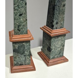 A pair of obelisks in green and pink marble