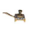 Small hand-held brass candle holder with enamelled decoration