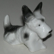 Sculpture Chien couché Fox Terrier , en porcelain