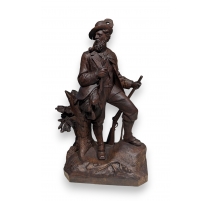 Chasseur en bois sculpté