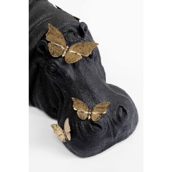 Hippopotame noir et papillons dorés