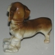 Sculpture Chien "Basset", en porcelaine brune.