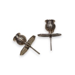A pair of silver-plated bronze candlesticks by Tric-Trac