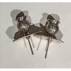A pair of silver-plated bronze candlesticks by Tric-Trac