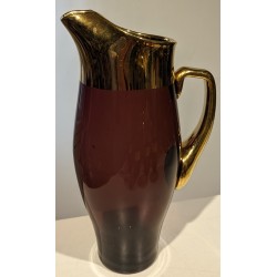 A carafe and five glasses made of gilded Bohemian crystal