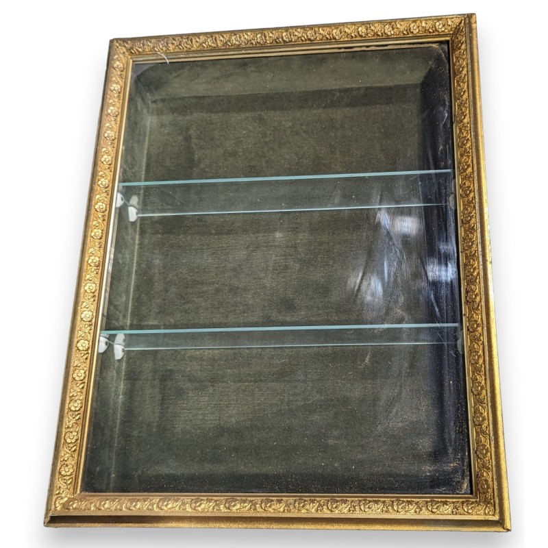 Small hanging display case with a gilded stucco frame