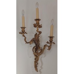 A pair of Louis XV wall sconces in gilded bronze