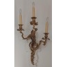 A pair of Louis XV wall sconces in gilded bronze